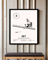 Quakertown Airport framed poster displayed in an airplane hangar