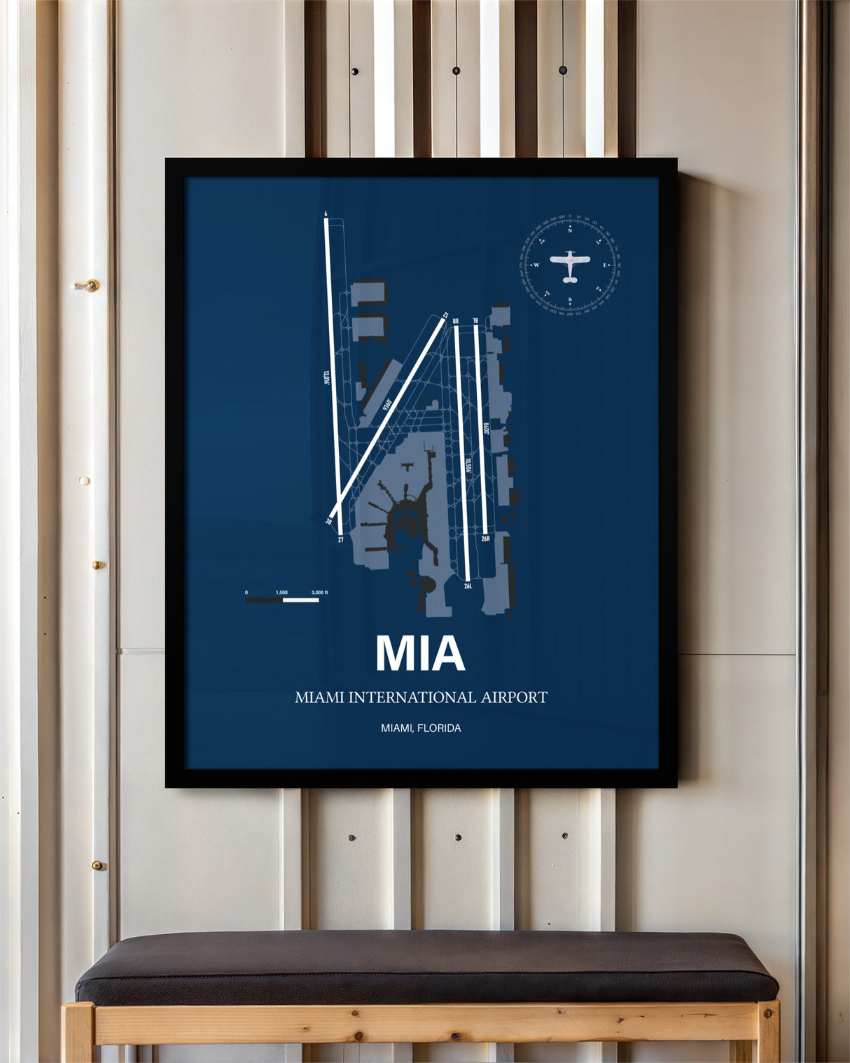 Miami International Airport framed poster displayed in an airplane hangar