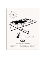 Gray Capital City Airport framed poster displayed in an airplane hangar