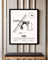 St. Clair County International Airport framed poster displayed in an airplane hangar