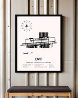 Phoenix Deer Valley Airport framed poster displayed in an airplane hangar