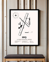 La Porte Municipal Airport framed poster displayed in an airplane hangar