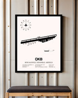 Bob Maxwell Memorial Airfield framed poster displayed in an airplane hangar