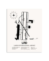 Gray Laredo International Airport framed poster displayed in an airplane hangar