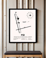 Presque Isle International Airport framed poster displayed in an airplane hangar