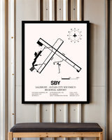 Salisbury-Ocean City Wicomico Regional Airport framed poster displayed in an airplane hangar