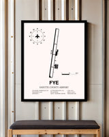 Fayette County Airport framed poster displayed in an airplane hangar
