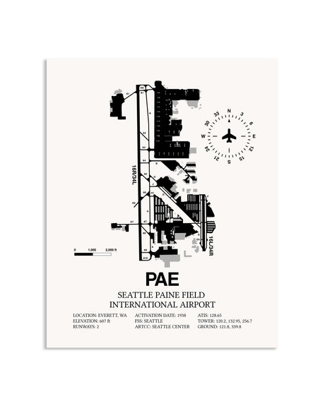 Gray Seattle Paine Field International Airport framed poster displayed in an airplane hangar