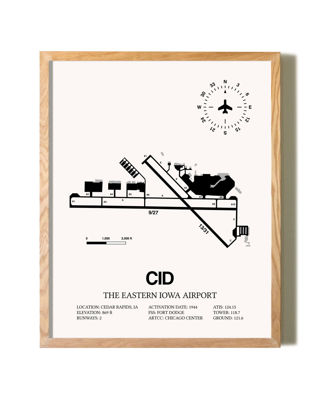 The Eastern Iowa Airport framed print in natural wood frame