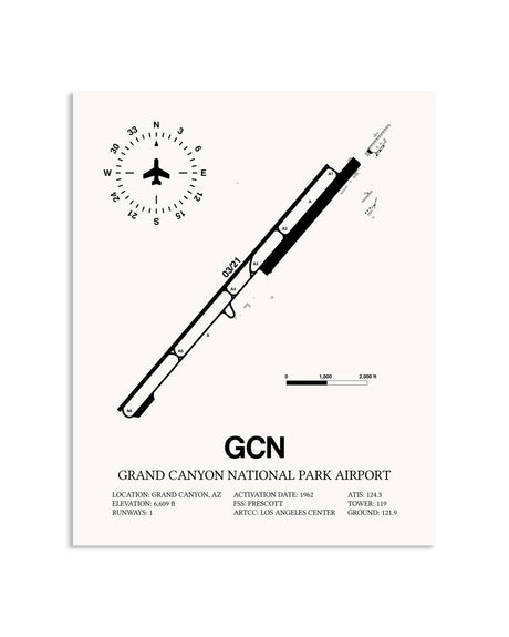 Gray Grand Canyon National Park Airport framed poster displayed in an airplane hangar