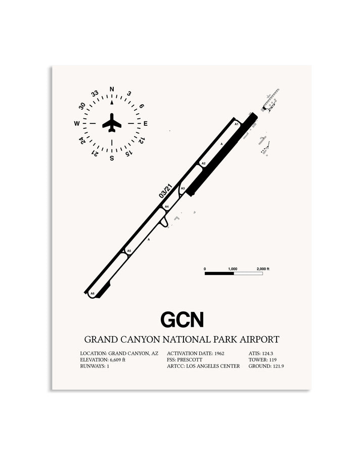 Gray Grand Canyon National Park Airport framed poster displayed in an airplane hangar