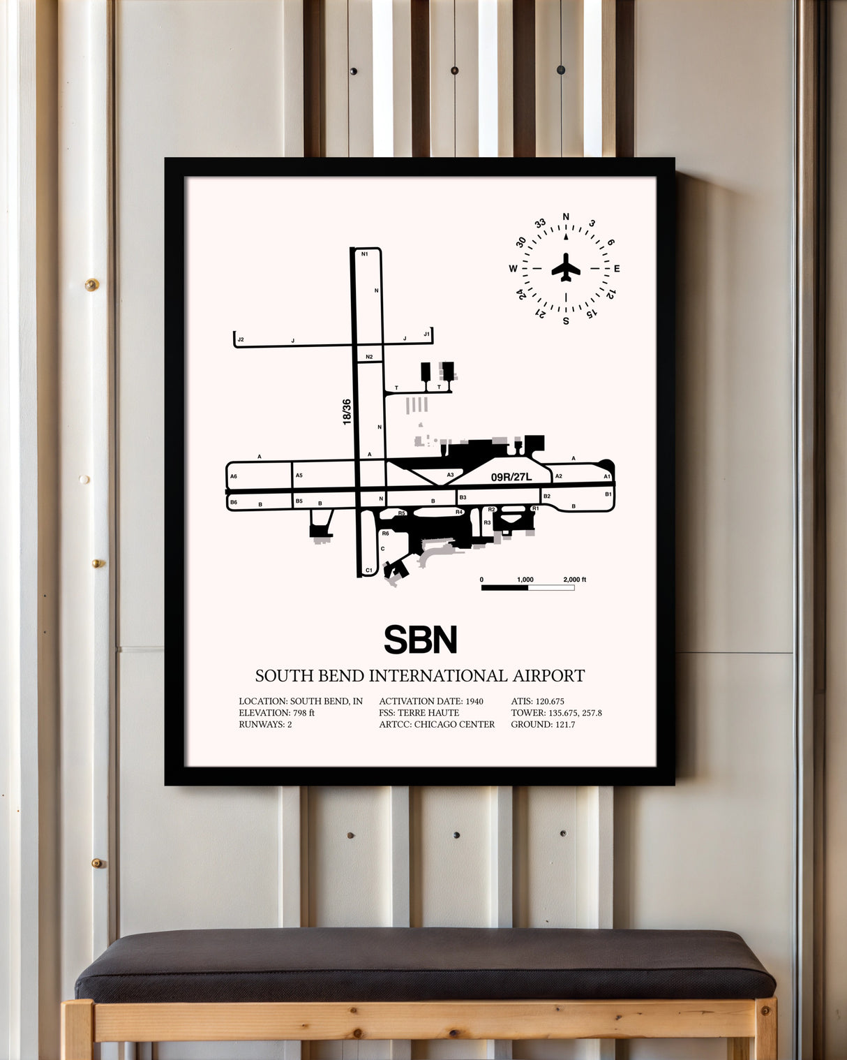 South Bend International Airport framed poster displayed in an airplane hangar