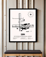South Bend International Airport framed poster displayed in an airplane hangar