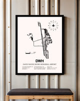 David Wayne Hooks Memorial Airport framed poster displayed in an airplane hangar