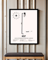 Gould Peterson Municipal Airport framed poster displayed in an airplane hangar