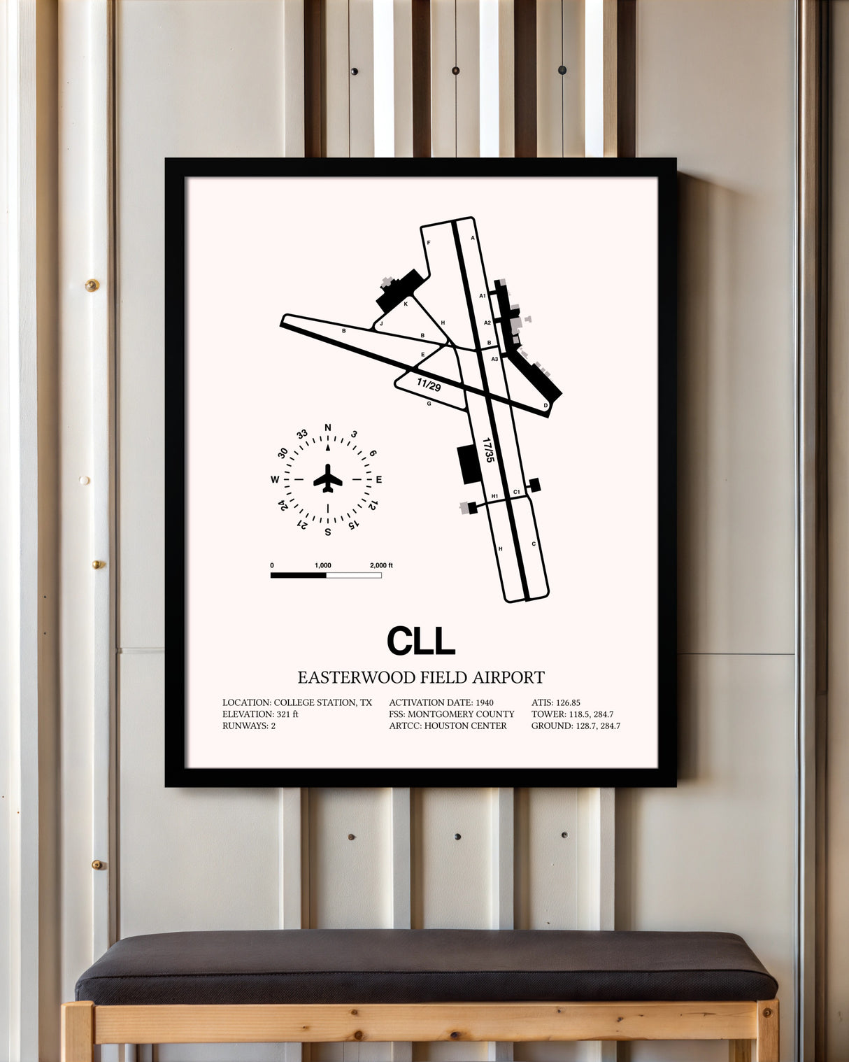 Easterwood Field Airport framed poster displayed in an airplane hangar