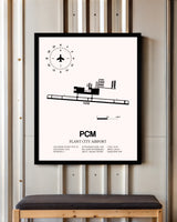 Plant City Airport framed poster displayed in an airplane hangar