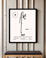 Cherokee County Regional Airport framed poster displayed in an airplane hangar