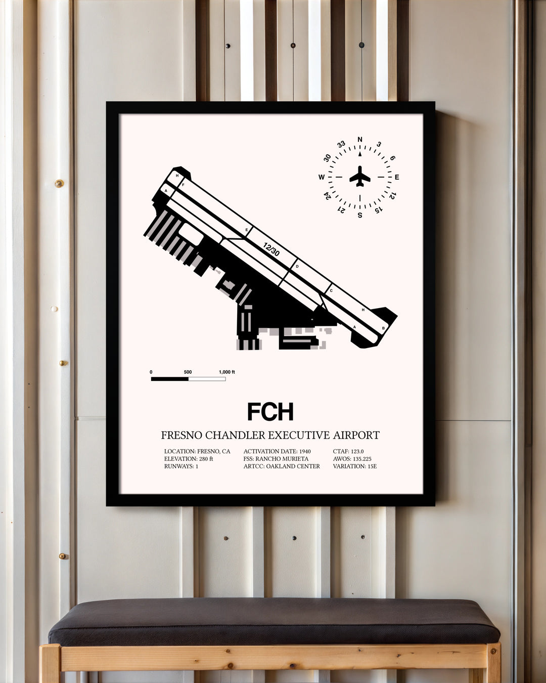 Fresno Chandler Executive Airport framed poster displayed in an airplane hangar