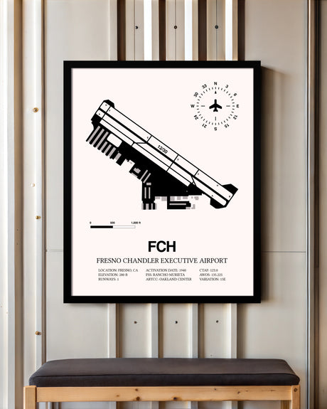 Fresno Chandler Executive Airport framed poster displayed in an airplane hangar