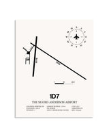 Gray The Sigurd Anderson Airport framed poster displayed in an airplane hangar