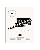 Gray Cable Airport framed poster displayed in an airplane hangar