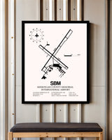 Sheboygan County Memorial International Airport framed poster displayed in an airplane hangar
