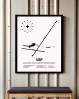 Hartness State Airport (Springfield) framed poster displayed in an airplane hangar