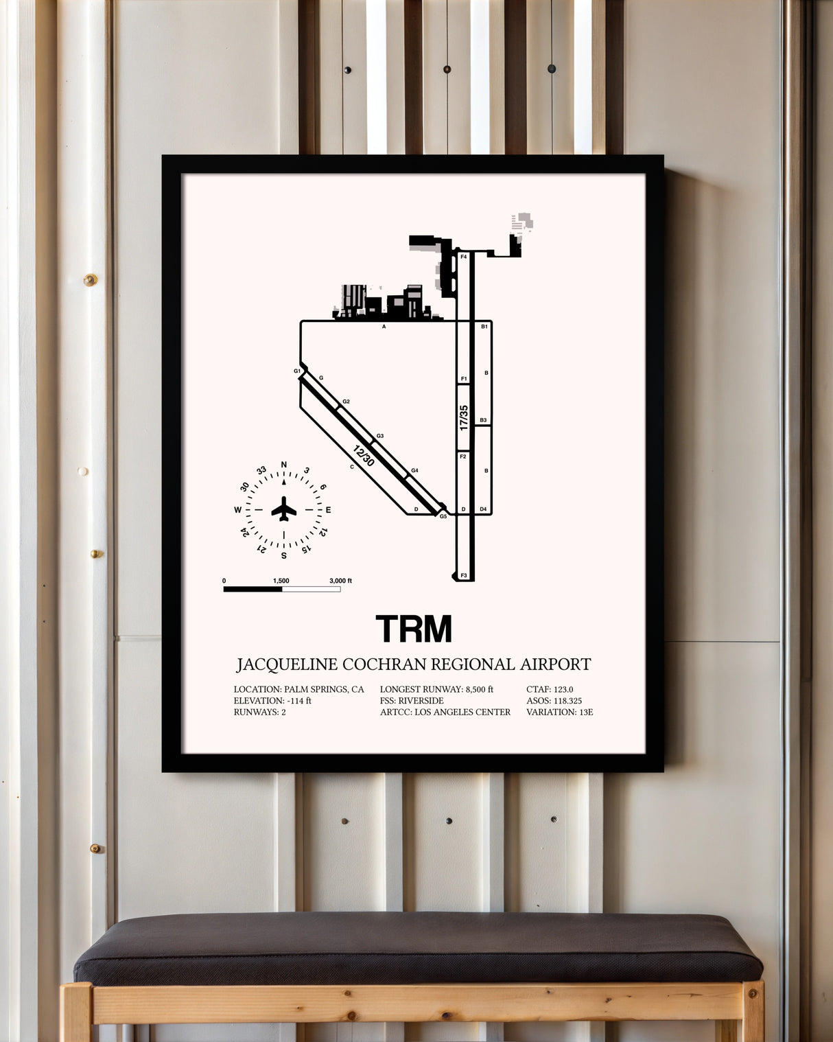 Jacqueline Cochran Regional Airport framed poster displayed in an airplane hangar