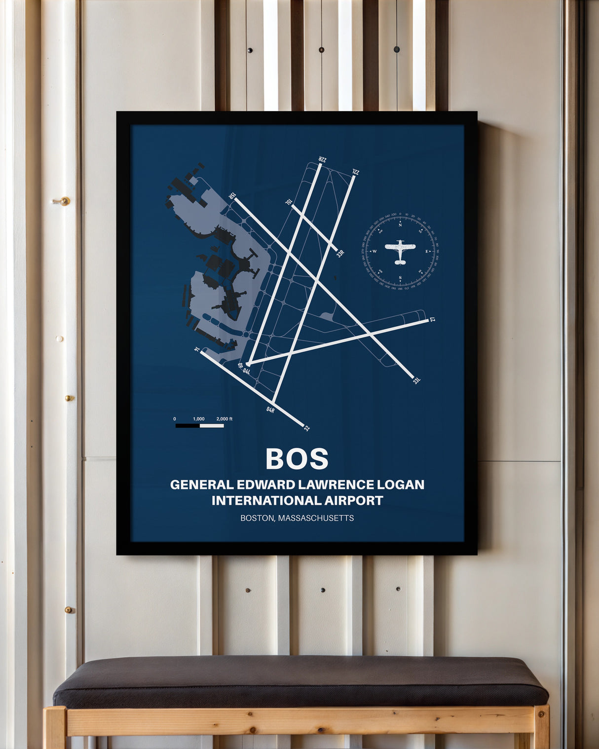 Boston Logan International Airport framed poster displayed in an airplane hangar