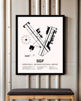 Springfield-Branson National Airport framed poster displayed in an airplane hangar