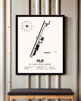 St. Clair County Airport framed poster displayed in an airplane hangar
