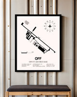 Offutt Air Force Base framed poster displayed in an airplane hangar