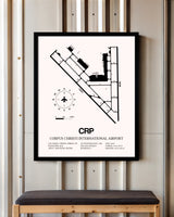 Corpus Christi International Airport framed poster displayed in an airplane hangar