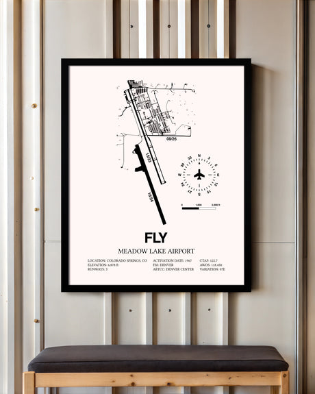 Meadow Lake Airport framed poster displayed in an airplane hangar