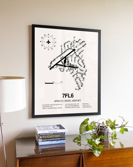 Spruce Creek Airport aviation wall décor in black wood frame