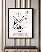 Batten International Airport framed poster displayed in an airplane hangar