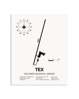 Gray Telluride Regional Airport framed poster displayed in an airplane hangar