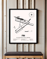 Flagler Executive Airport framed poster displayed in an airplane hangar
