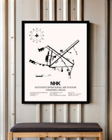 Patuxent River Naval Air Station (Trapnell Field) framed poster displayed in an airplane hangar
