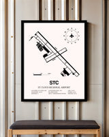 St. Cloud Regional Airport framed poster displayed in an airplane hangar