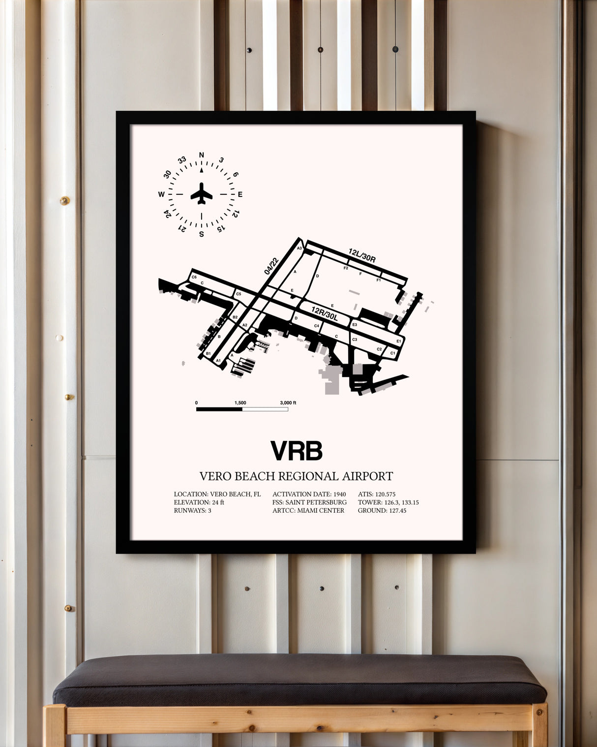 Vero Beach Regional Airport framed poster displayed in an airplane hangar
