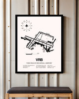 Vero Beach Regional Airport framed poster displayed in an airplane hangar