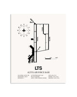 Gray Altus Air Force Base framed poster displayed in an airplane hangar