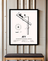 Watertown Regional Airport framed poster displayed in an airplane hangar