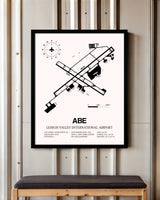 Lehigh Valley International Airport framed poster displayed in an airplane hangar