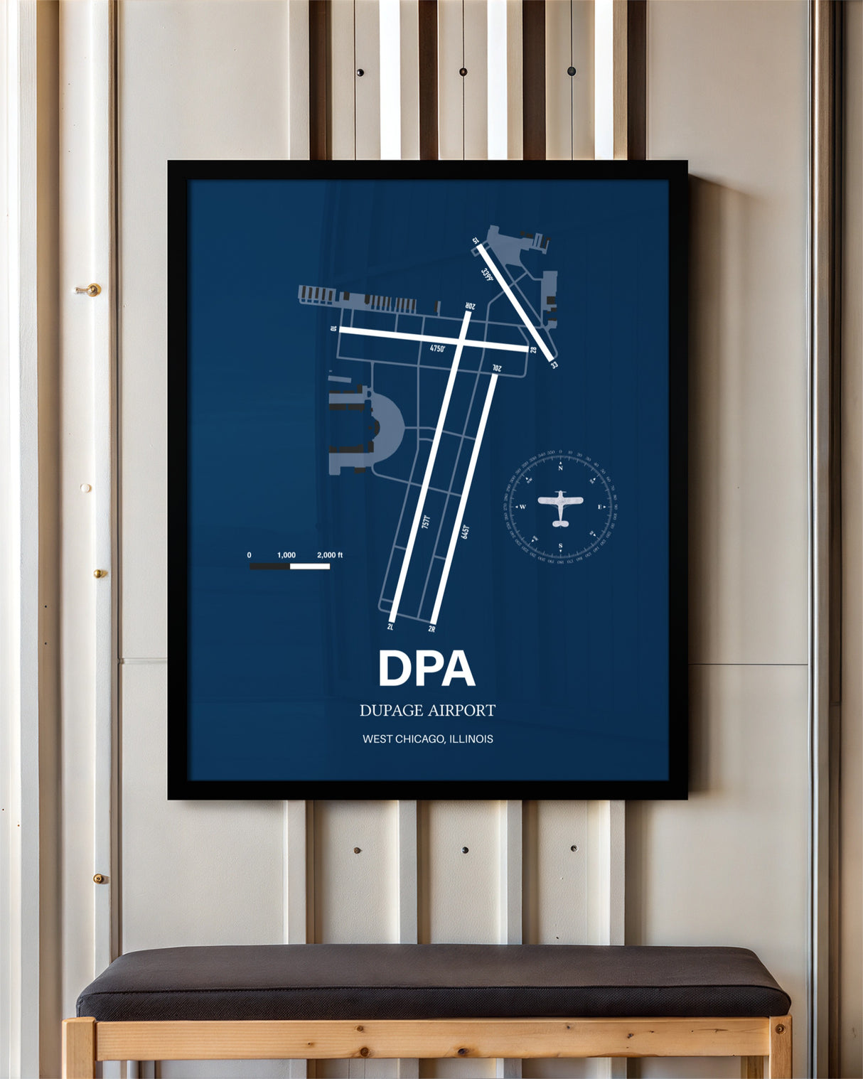 DuPage Airport framed poster displayed in an airplane hangar