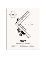 Gray Brookhaven Airport framed poster displayed in an airplane hangar