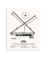Gray Las Cruces International Airport framed poster displayed in an airplane hangar