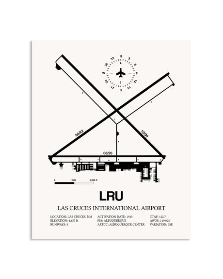 Gray Las Cruces International Airport framed poster displayed in an airplane hangar